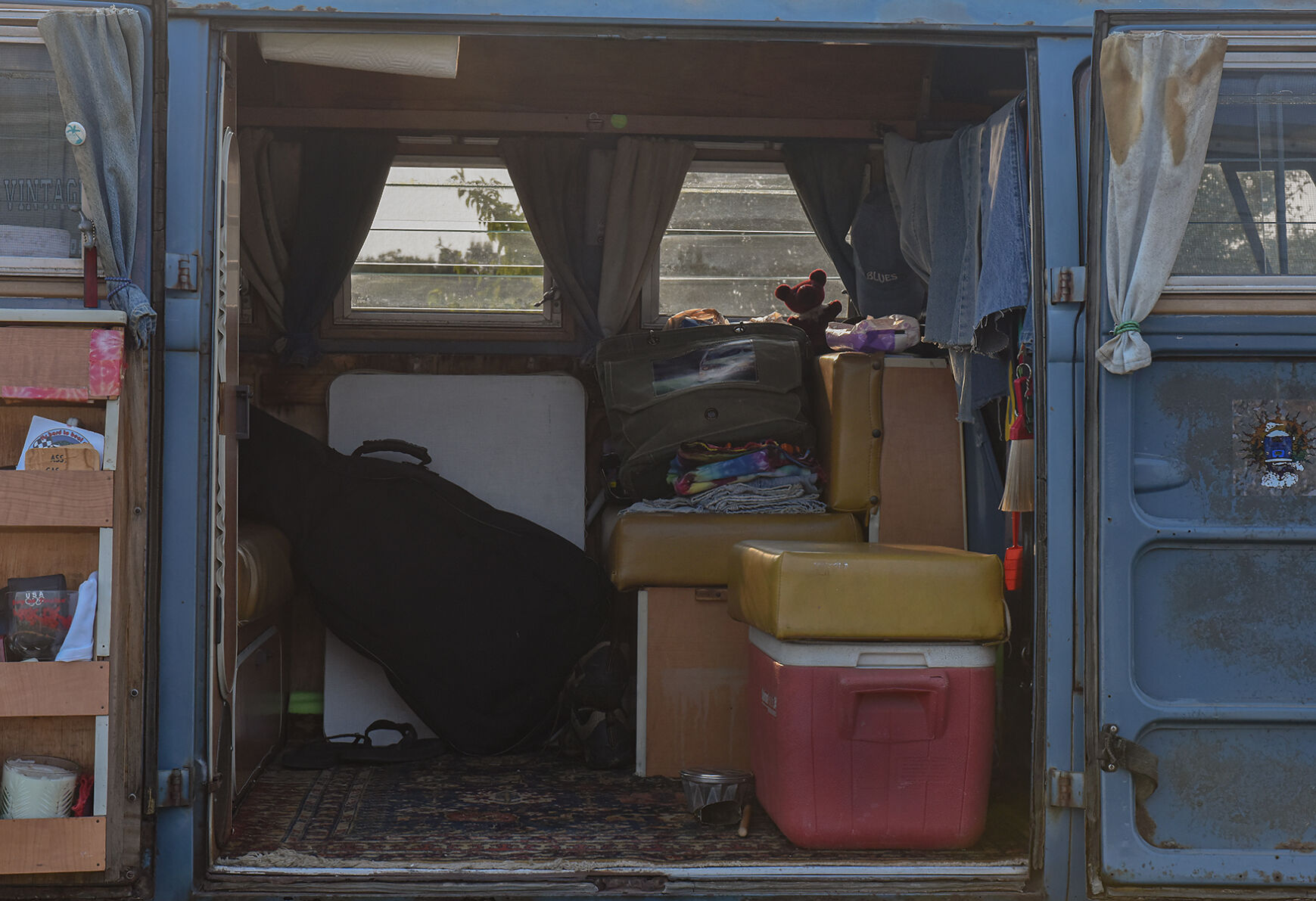 A Volkswagen Vanagon sits with its doors open
